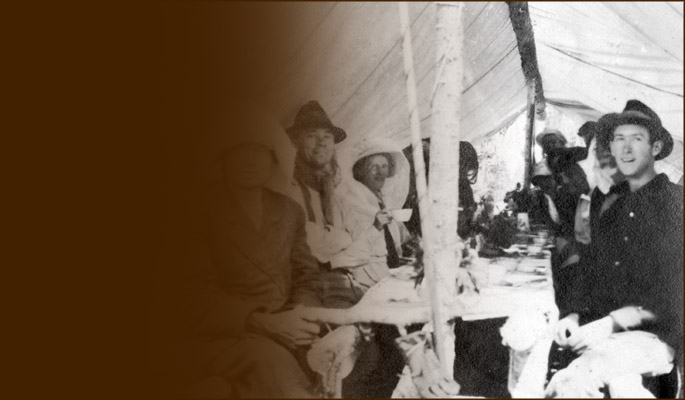 Camp meal at rustic table. Photo BCMC Archives 4-08.