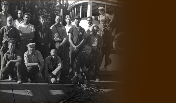 Climbing group on dock with boat-crew. Photo BCMC Archives 37-92.