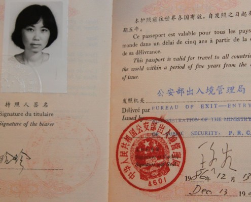 Alice’s passport, open to her photograph and signature.
