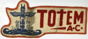 Felt jacket patch stating “Totem A.C.” next to an image of a totem pole.