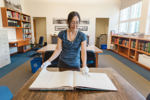 Reference Historian Daien Ide supports research and exploration of North Vancouver and its people through archival collections, research and exhibits. Public access to the Archives’ Reading Room is currently by appointment only. Photo: Alison Boulier