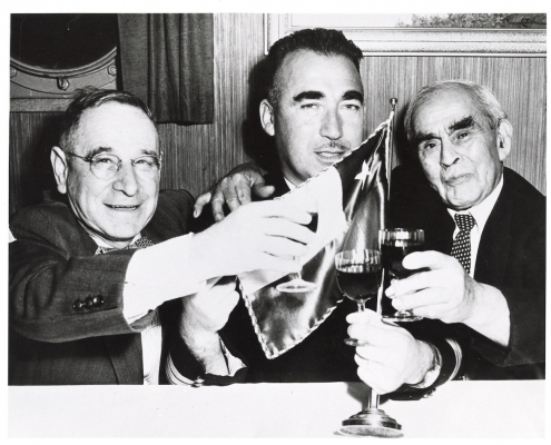 Chilean Consul H.G. Morris (left), Capt. Vargas (centre) and Manuel Silva (right) celebrating Chilean Independence Day. NVMA 6364.