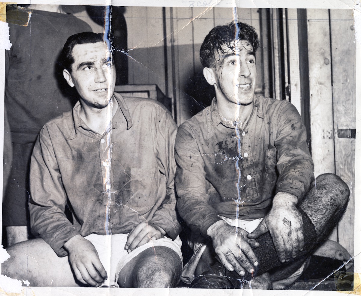 Damaged photograph of North Shore United players Nick Glover (left) and Jimmy Spencer, ca. 1935. NVMA 8030