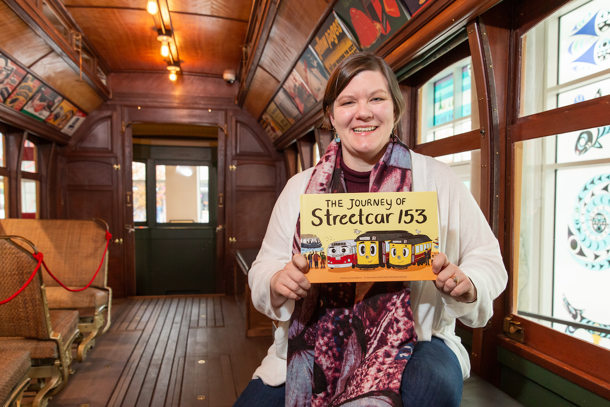 Program Coordinator and author Carol Ballard with her new book on Streetcar 153. Photo: Alison Boulier
