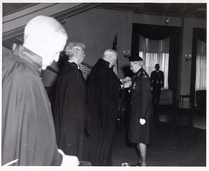 General Perks investing Mrs. Phyllis Munday as Commander Sister, St. John's Ambulance, Nursing Division, at Government House in Victoria, BC, 15 May 1965. NVMA 5669